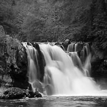 A beautiful waterfall is one of the attractions near the Pioneer Trading Post