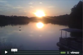 thumbnail image of the video describing the Pioneer Trading Post showing the lake